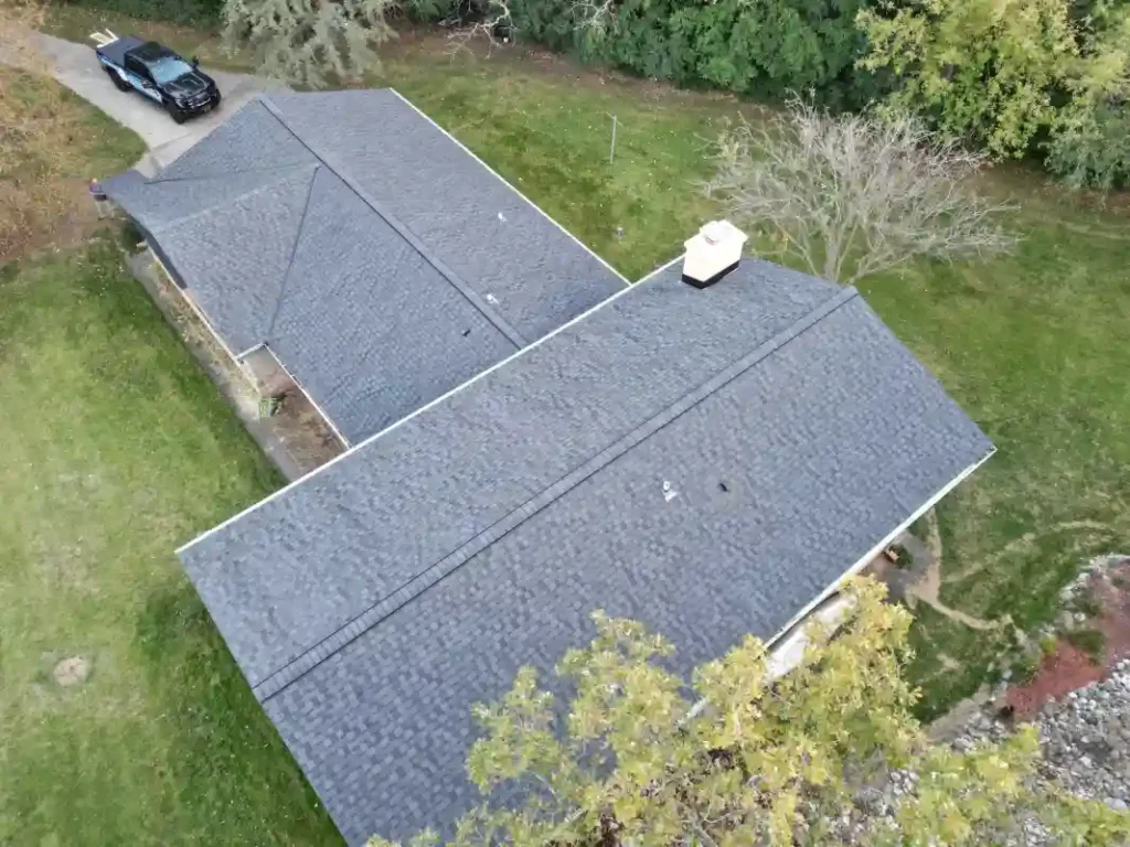 Finished roof replacement project showing improved exterior roof condition Finished roof replacement project showing improved exterior roof condition