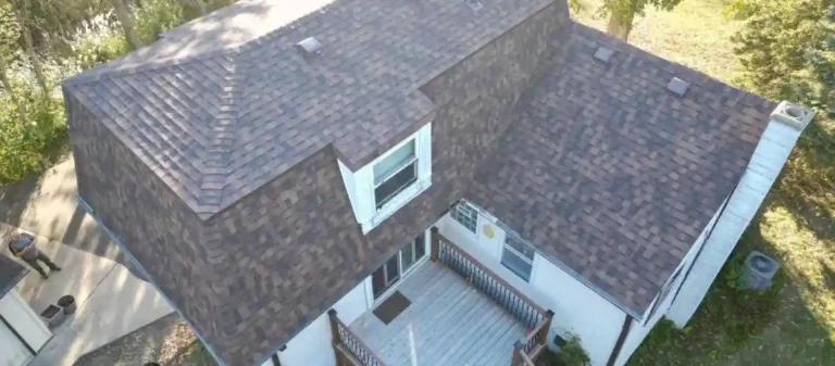 Finished roof replacement project showing new shingles and improved exterior Finished roof replacement project showing new shingles and improved exterior