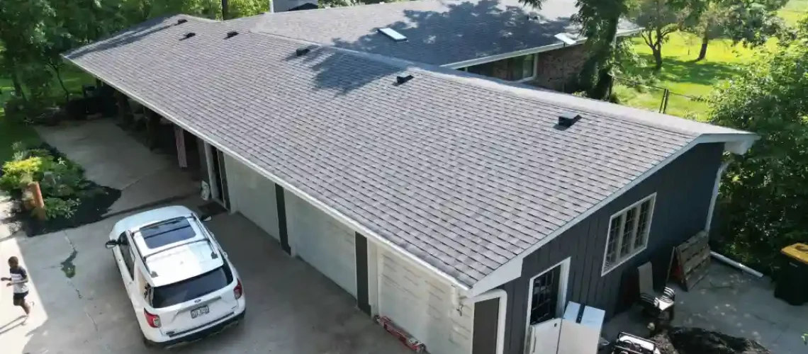 Completed roofing project with new shingles and improved exterior appearance